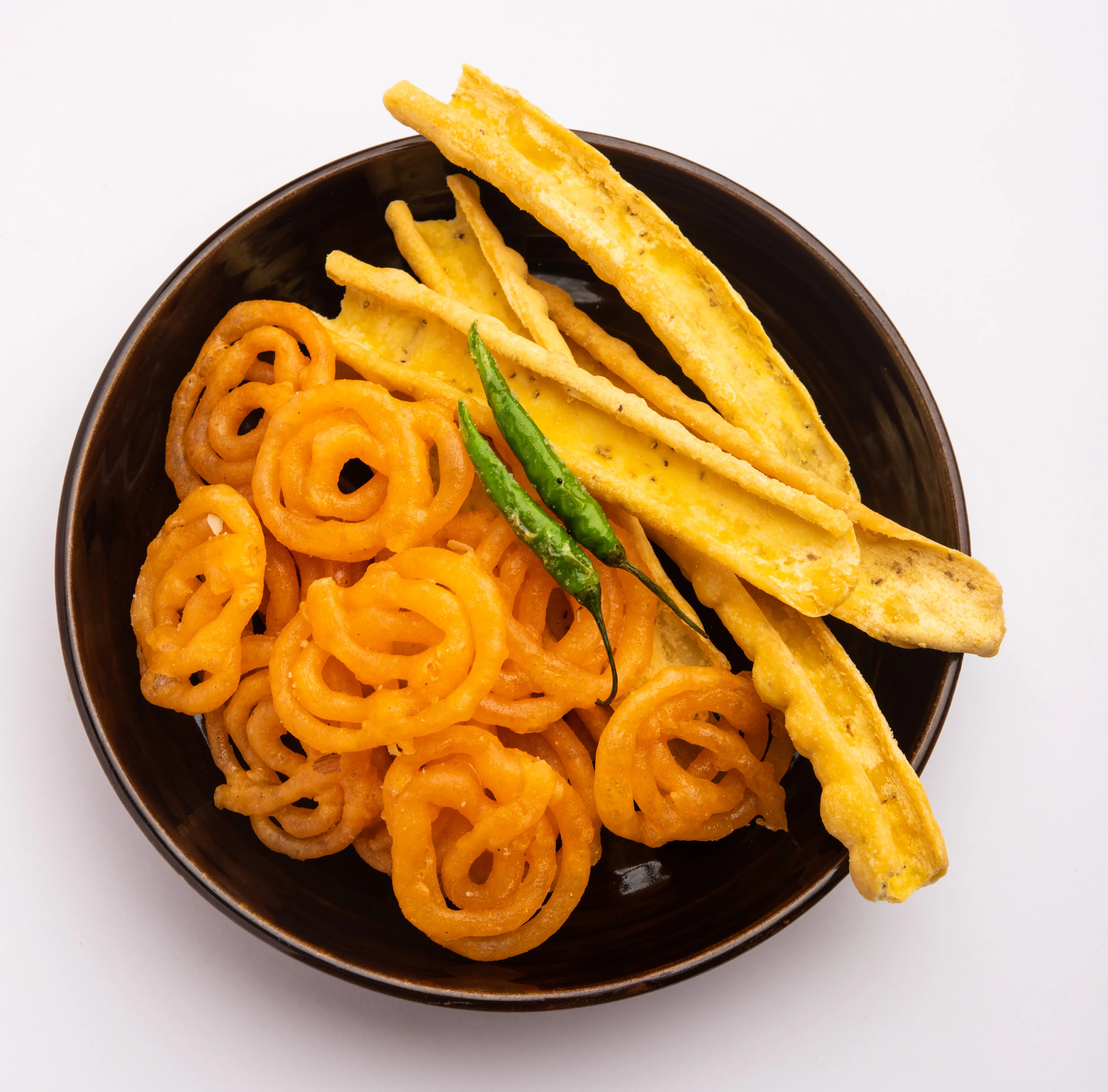 Image of an Indian dessert and snack - Jalebi with Fafda