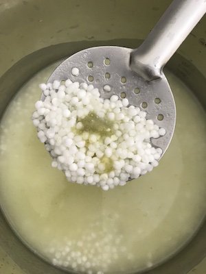 Tapioca pearls in a ladle