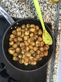 Coating masala over potatoes