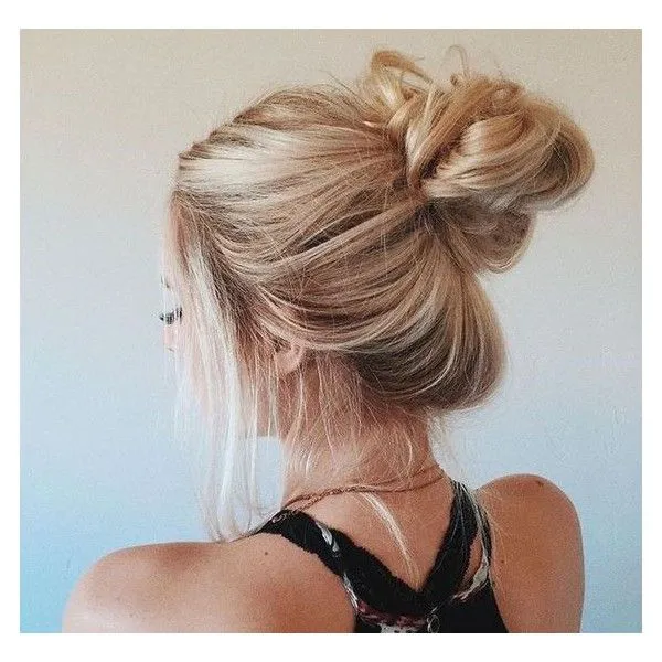 Model with a messy bun hairstyle