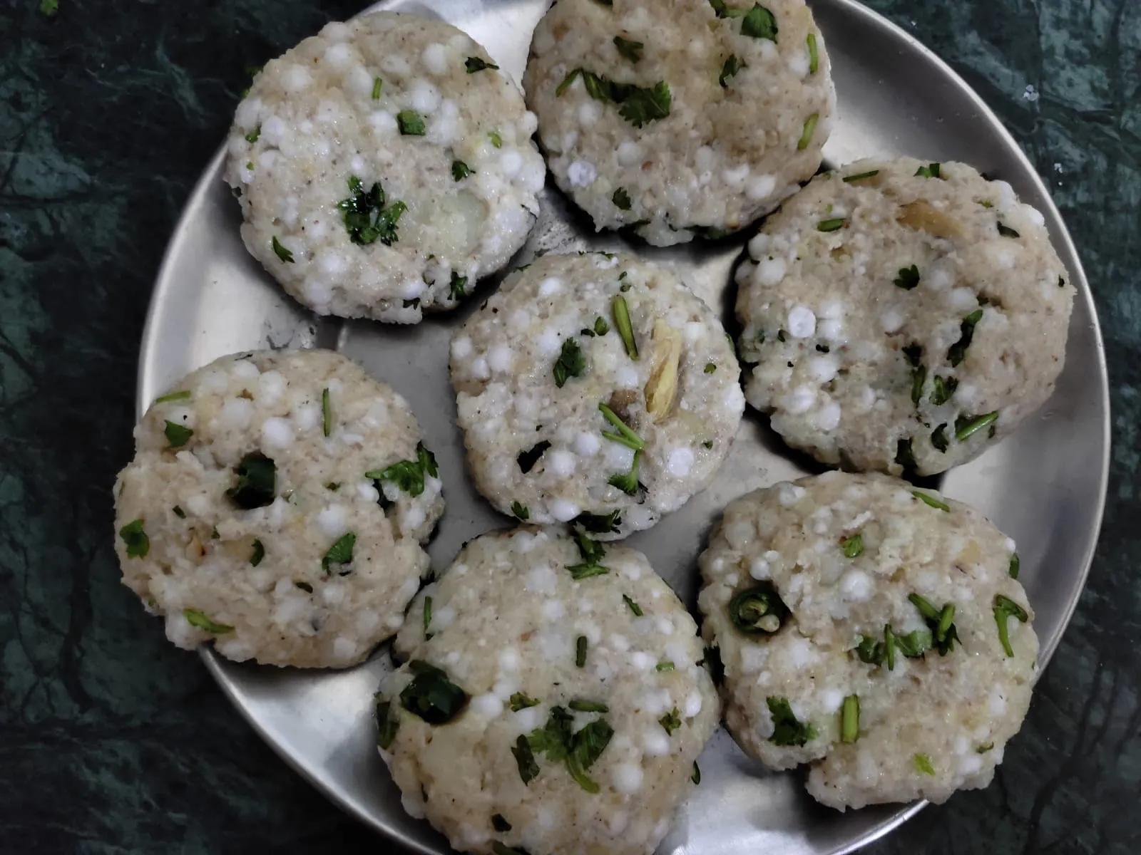 tikkis for sabudana vada rolled out in a plate