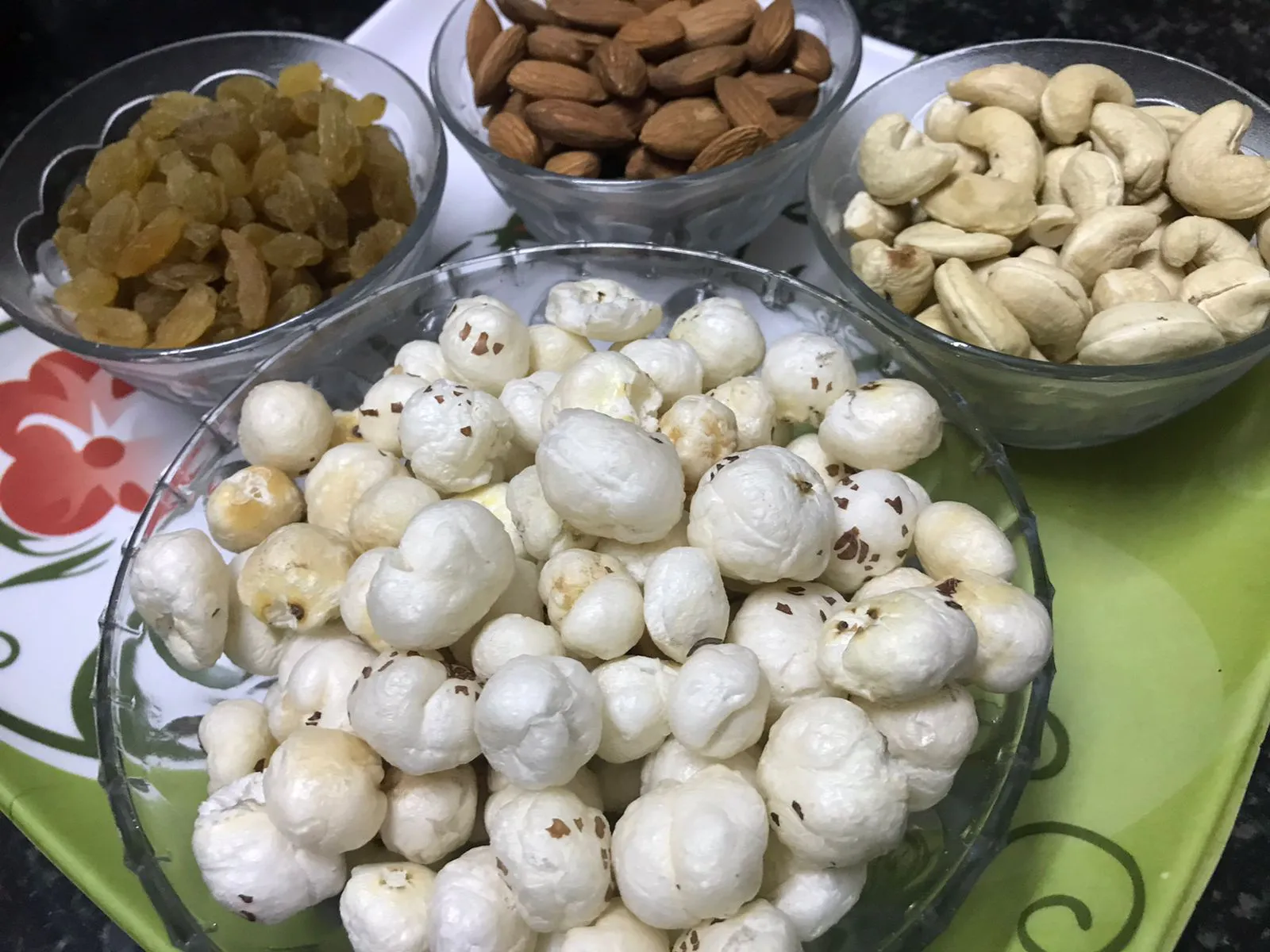 Bowls with different dry fruits and makhana in a plate