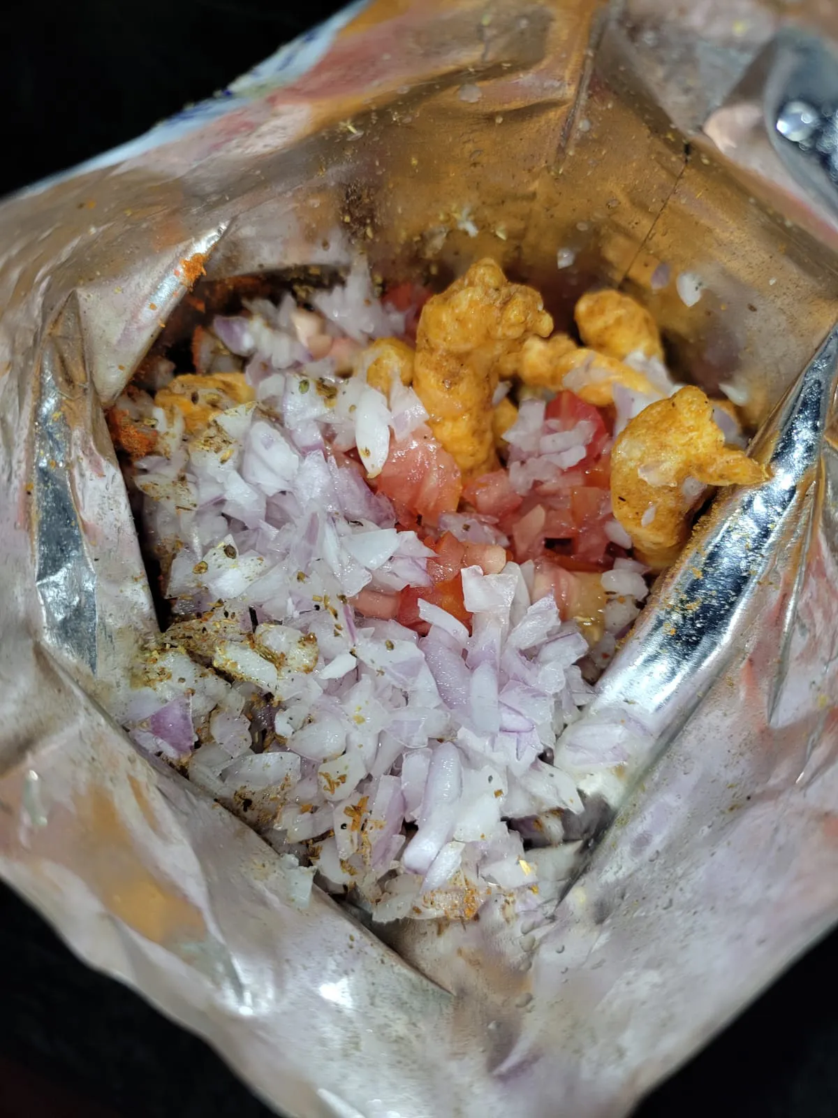 Adding all ingredients for kurkure masala snack