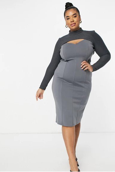 a woman wearing a grey full sleeve dress