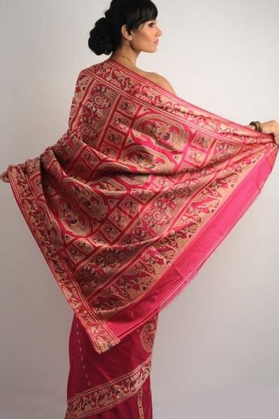 a woman wearing Baluchari and Swarnachari silk saree