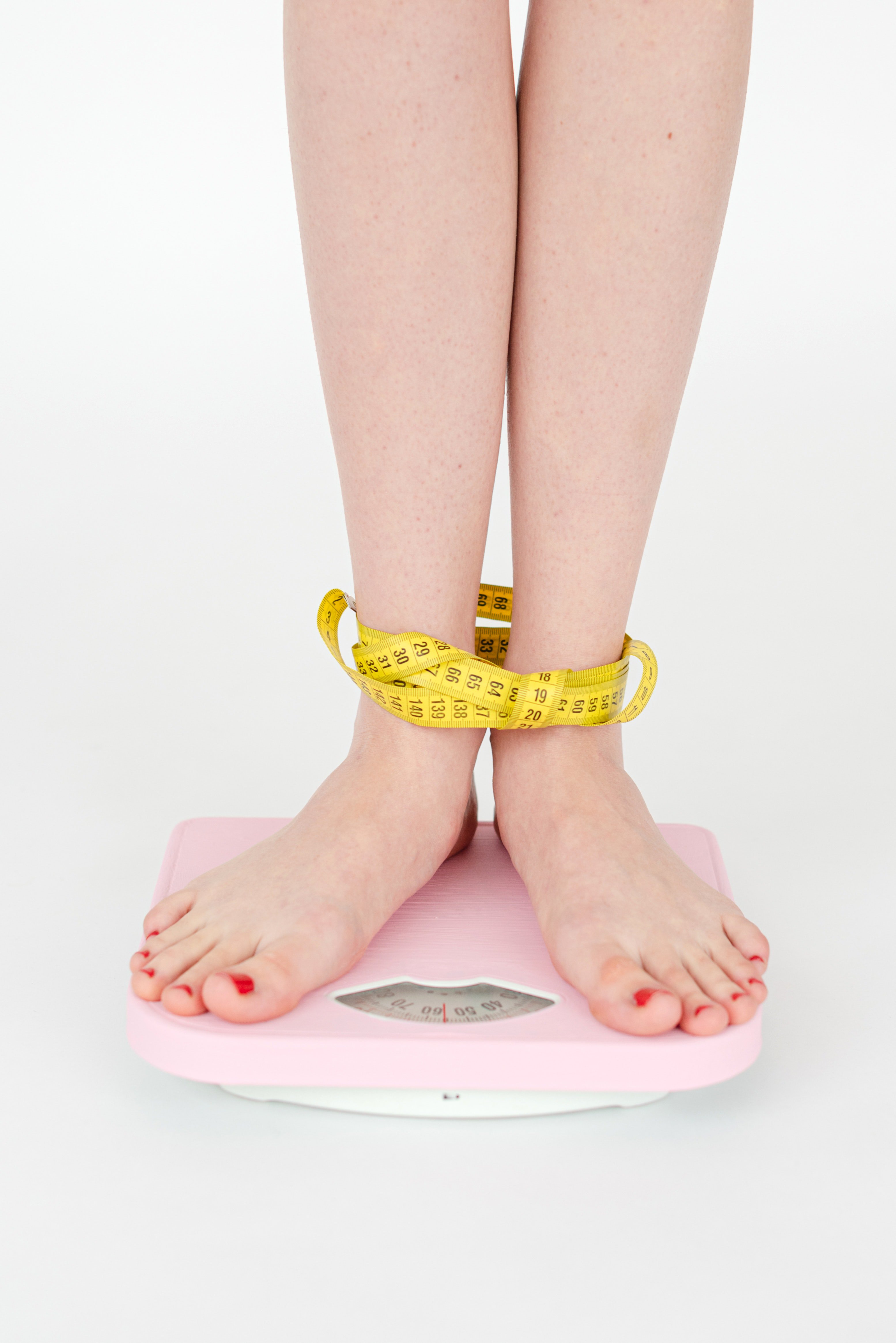 A woman standing on weighing scale