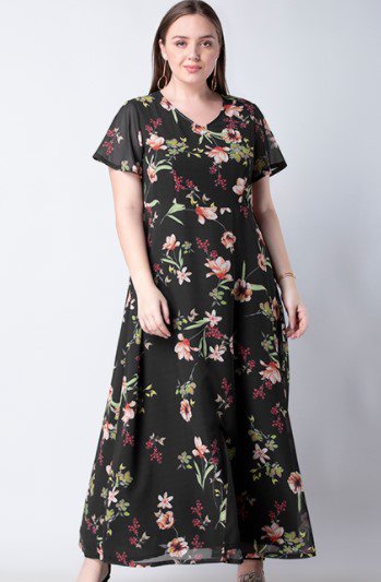 lady wearing a black dress with floral pattern