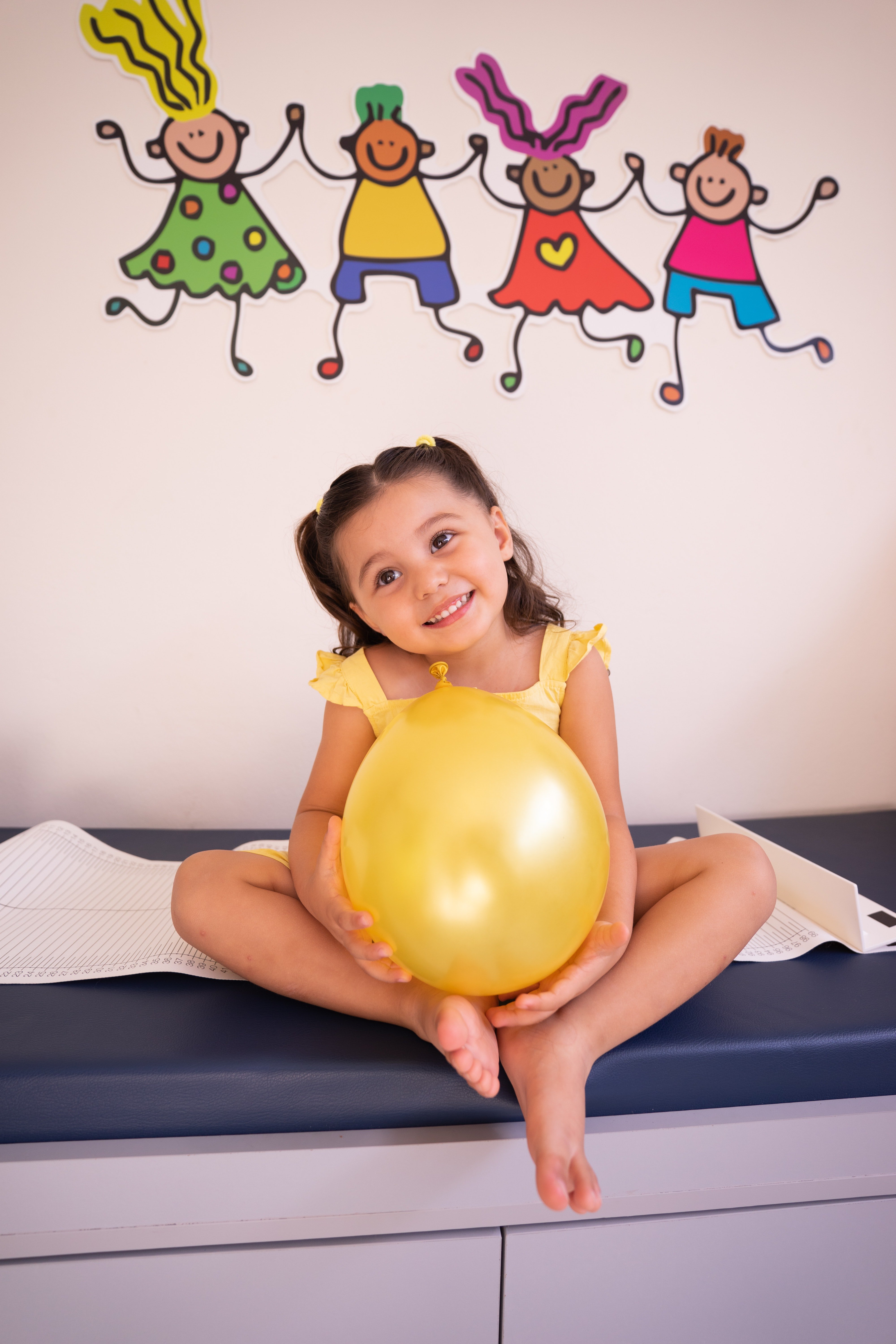 A happy girl holding a balloon