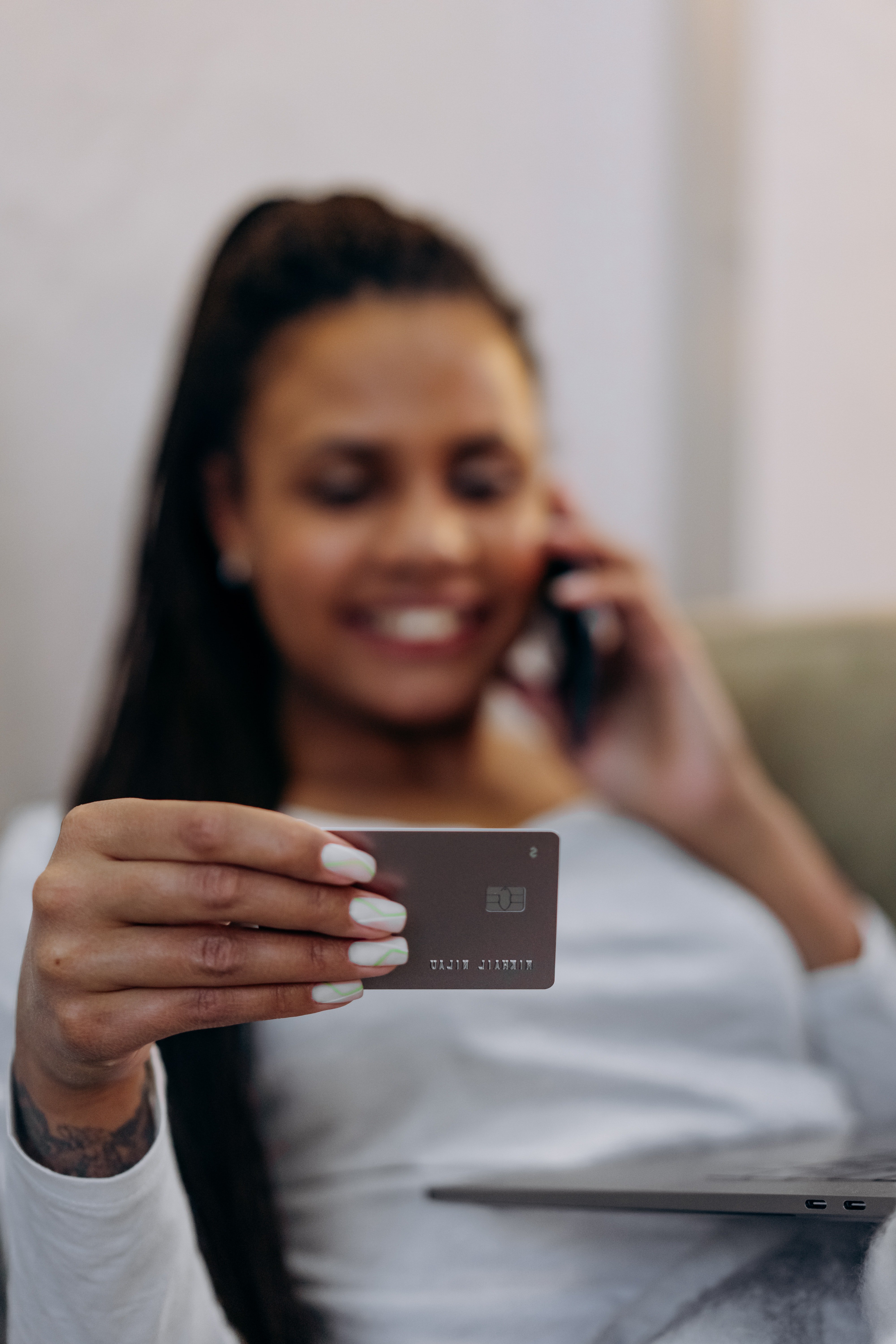 A woman holding a credit card