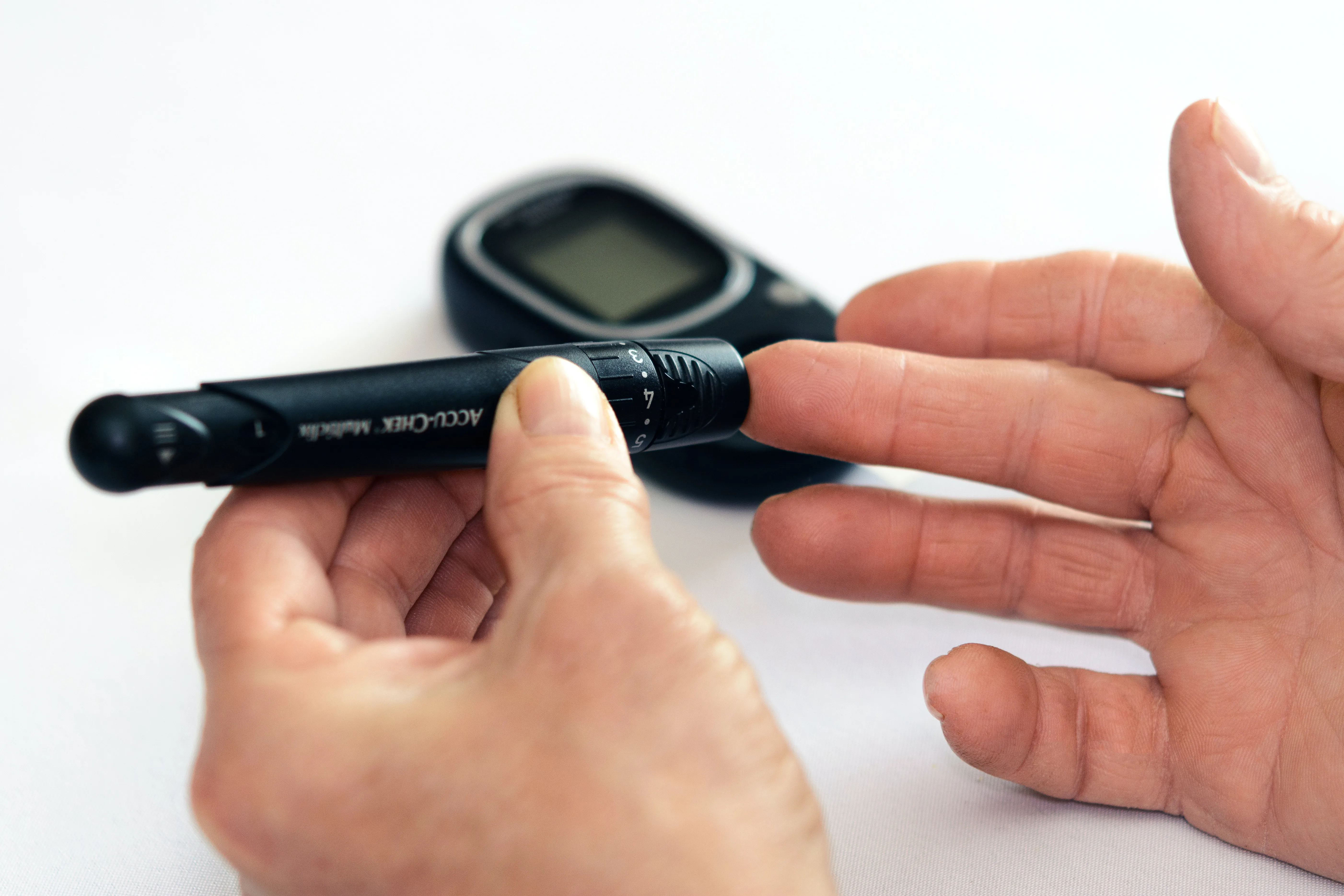 a person checking their blood glucose levels