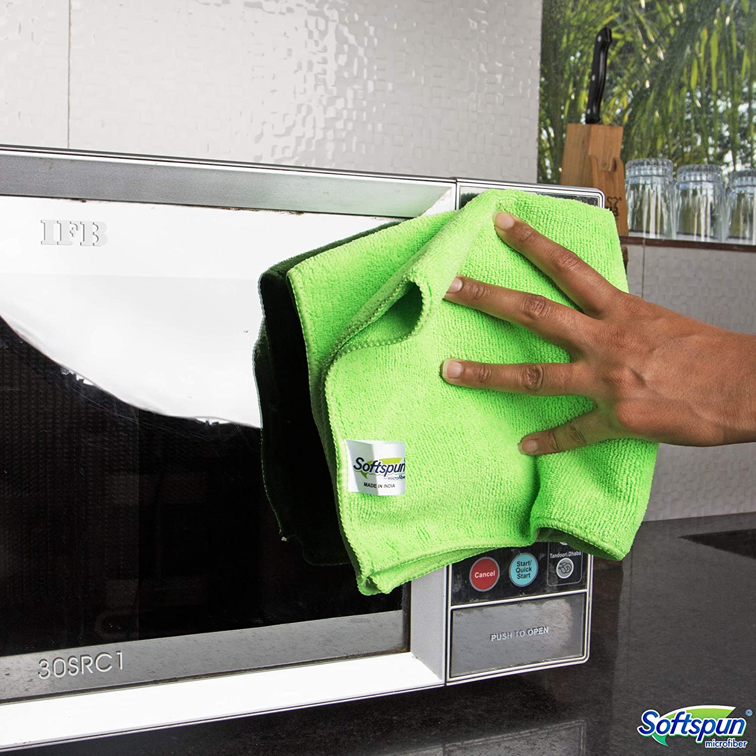 Microwave being cleaned with Microfiber Cleaning Cloth