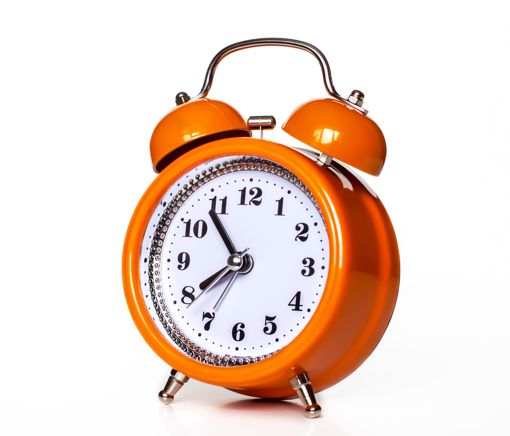 An orange alarm clock