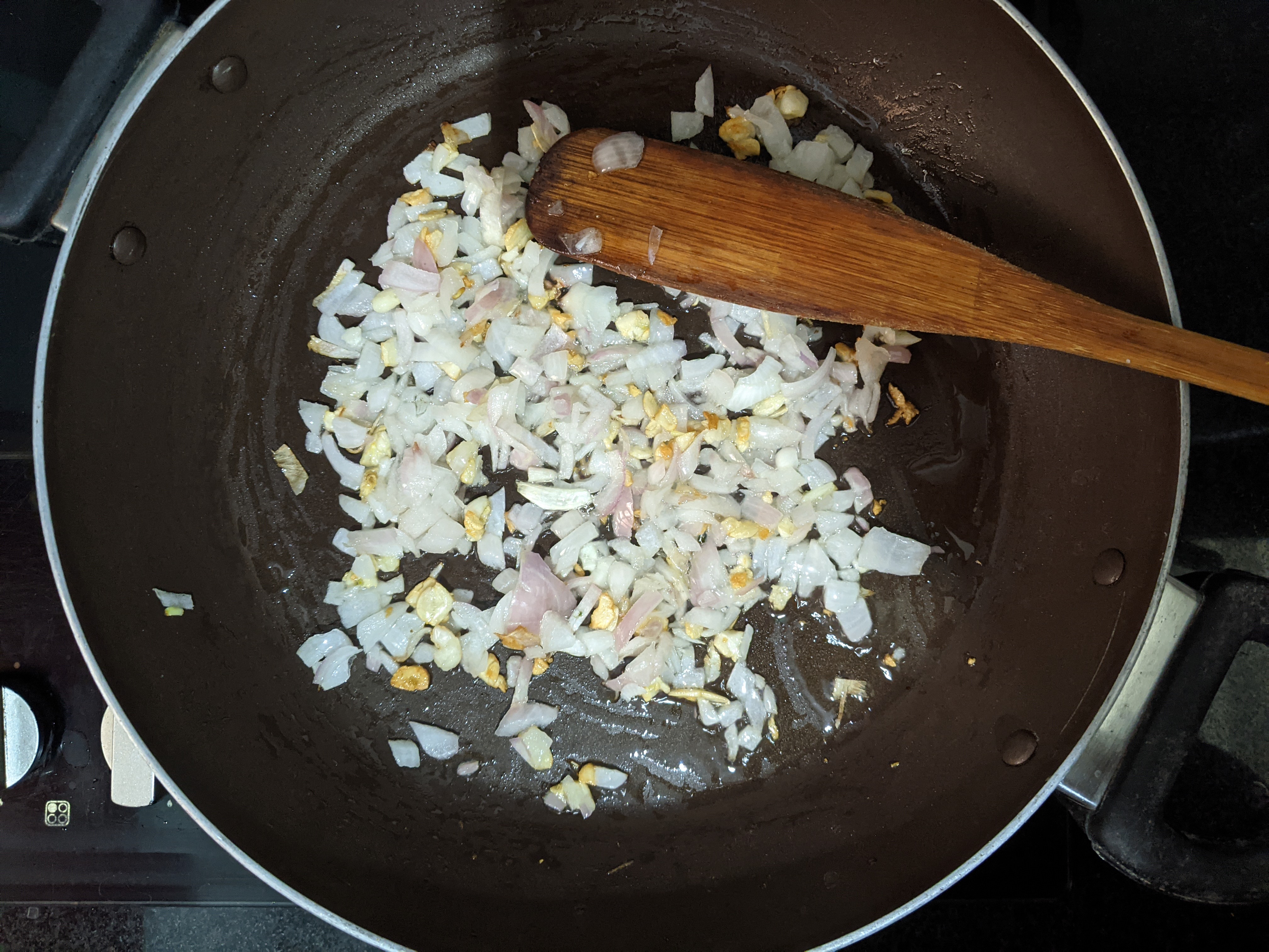 sautéing onion in a pan
