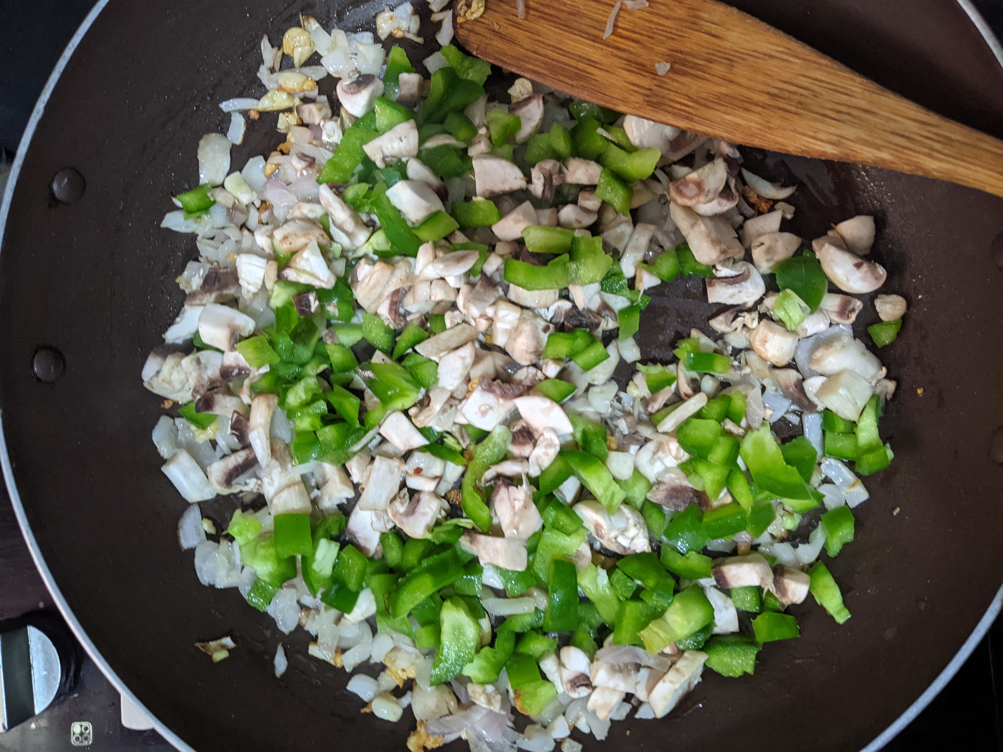 sautéing veggies in a pan
