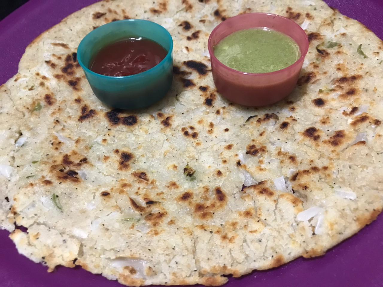 oats chilla served with chutney and ketchup