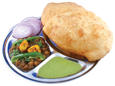 A plate of chhole bhature, onion and chutney