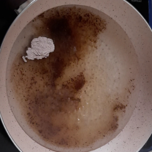 Water, black salt, cumin powder and sugar in a pan