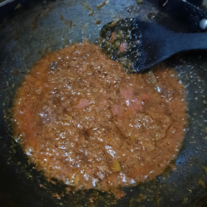 tomatoes and onion frying in oil