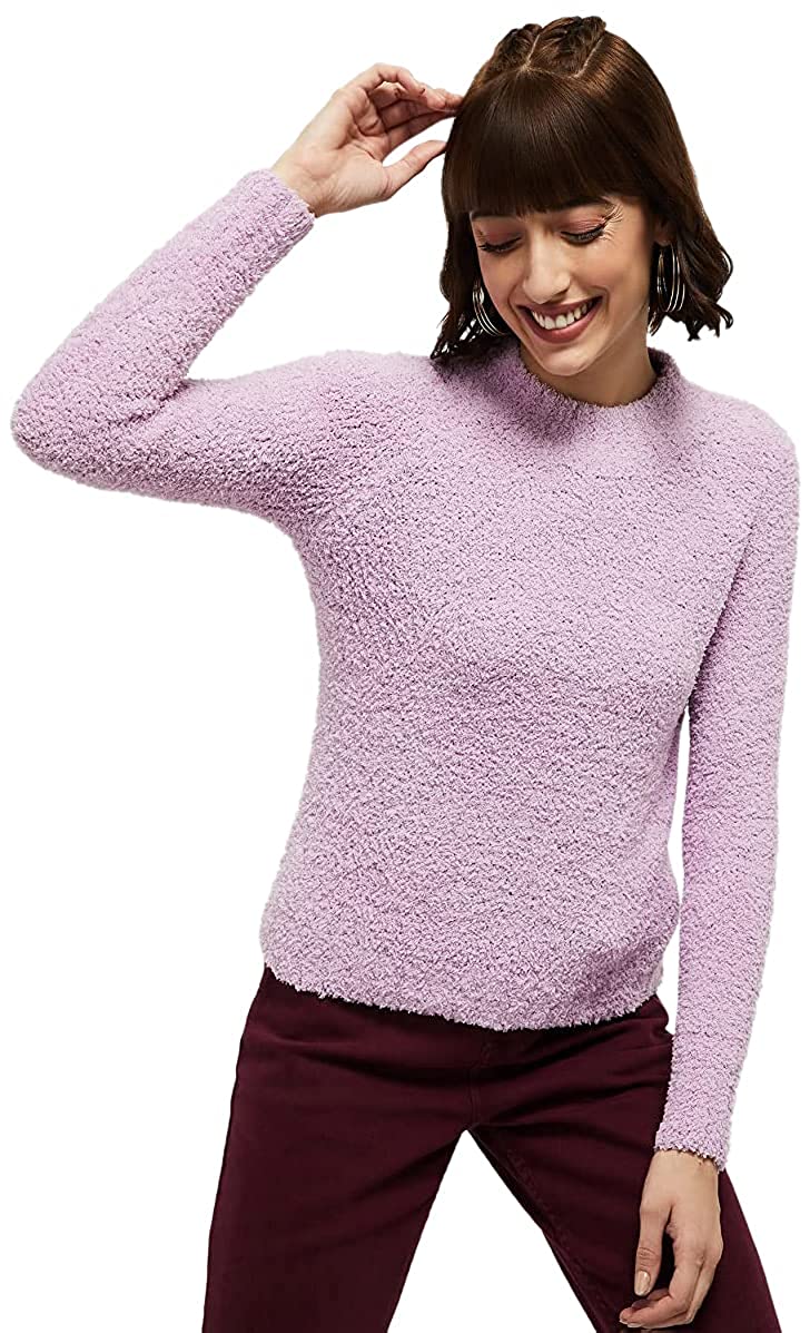 Model wearing a fuzzy lilac sweater