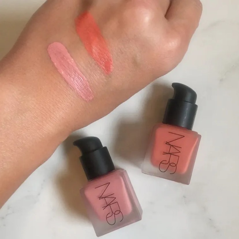 A hand with Nars blush swatches