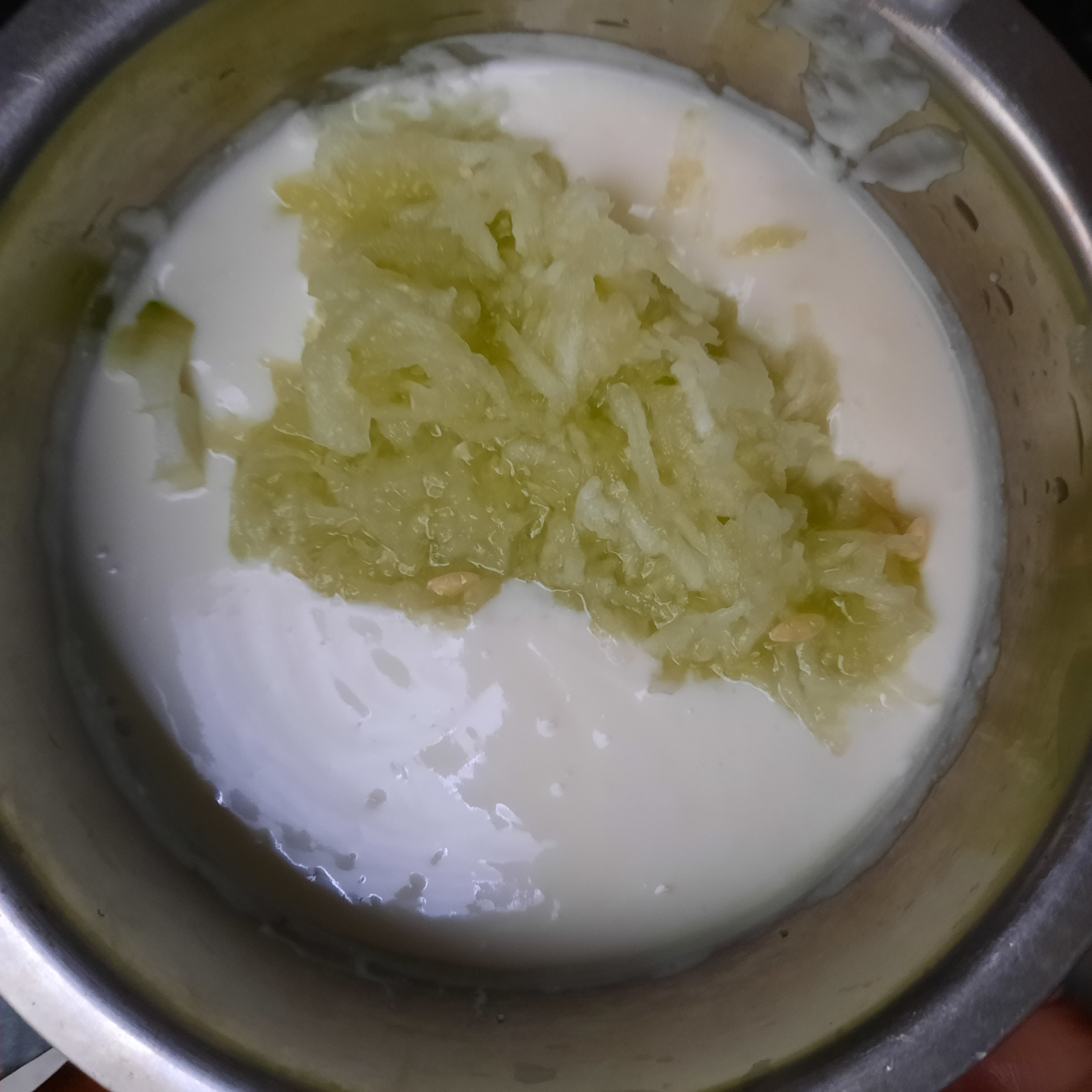 grated onions and cucumber in curd