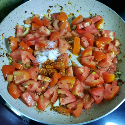 Add salt and spices to pizza sauce saute